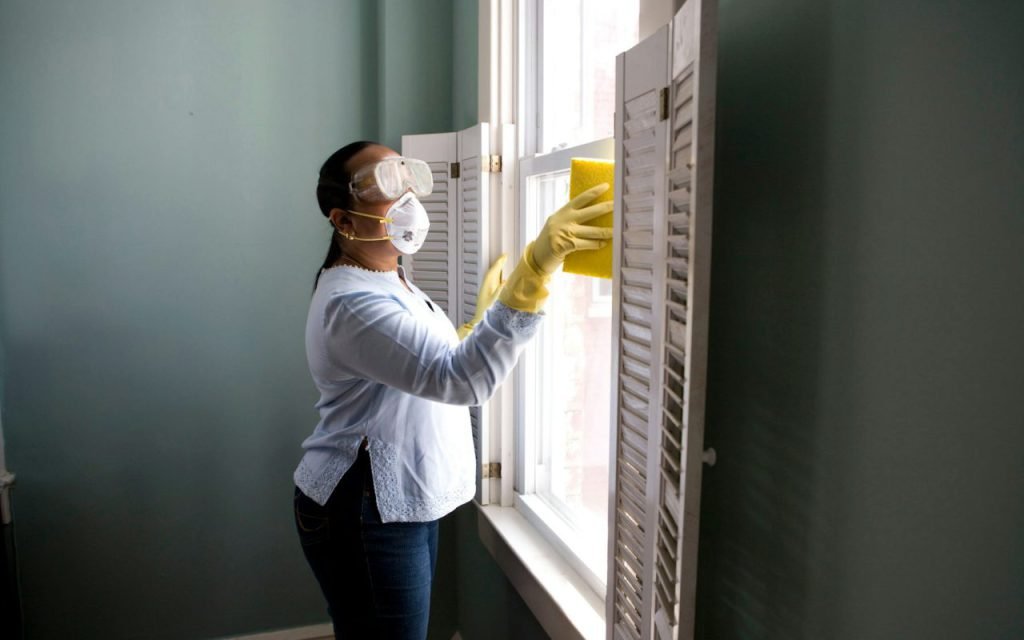 A person working on a home window