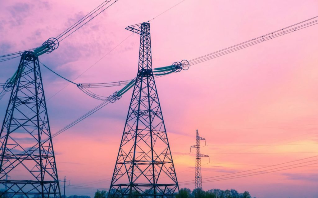 High-voltage power lines stretching across the landscape