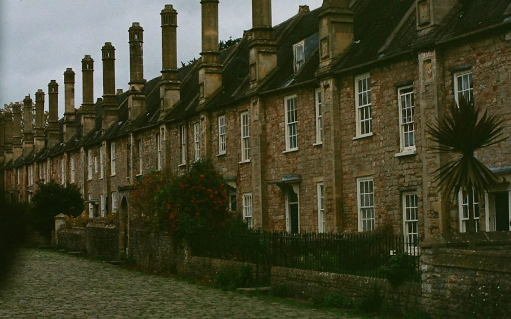 A historic street with old buildings in soft morning light