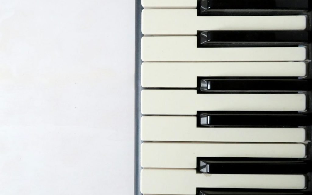 Close-up of hands playing piano keys