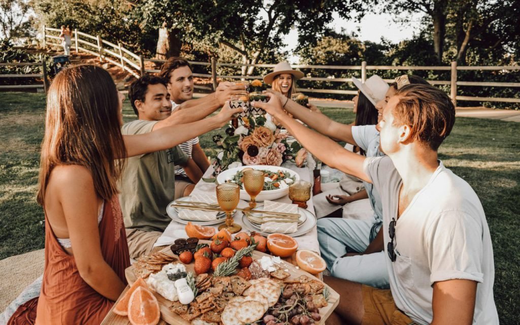 Friends sharing tacos around a table